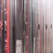 Rows of network server racks with red and blue cables in a data center